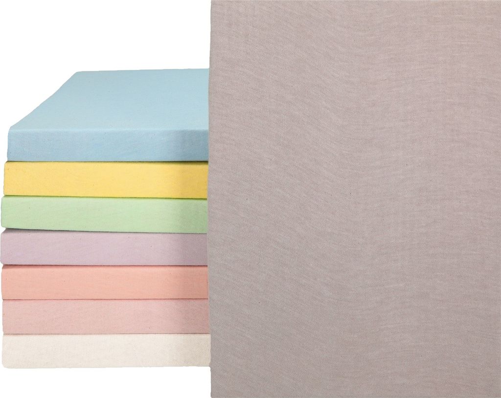 A stack of colorful fitted sheets next to a larger gray sheet.