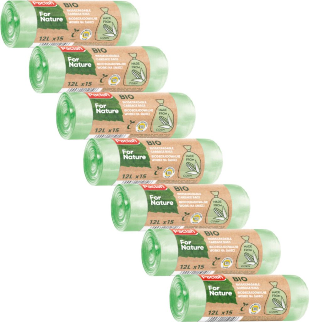 A stack of rolled-up green trash bags with brown labels.