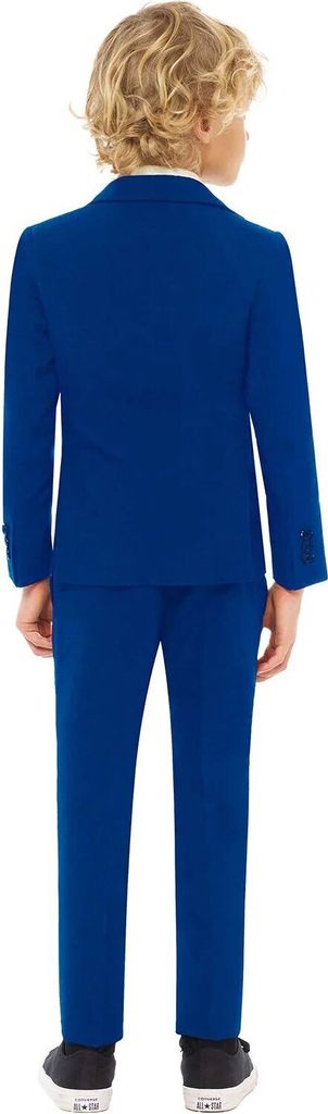 A young boy is shown from the back wearing a blue suit and black shoes.