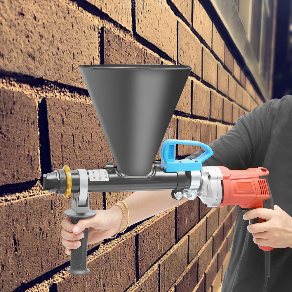 A person is holding a mortar gun against a brick wall.