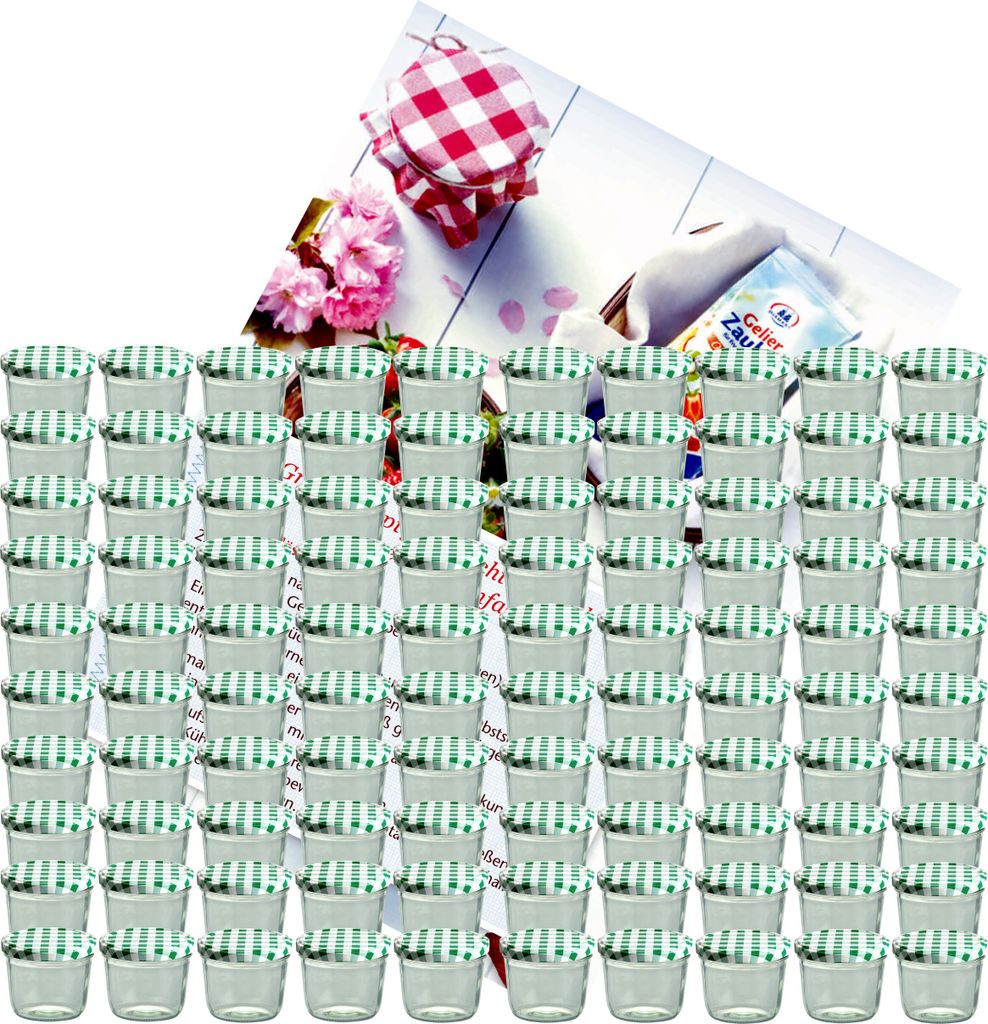 A large collection of small glass jars with green and white checkered lids, arranged in rows. In the background, there are pink flowers, a red and white checkered cloth, and a small packet with German text.