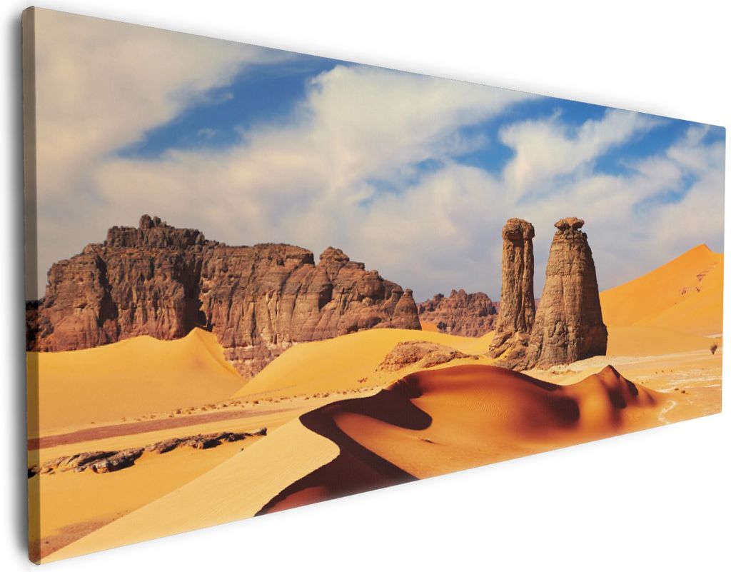 Wallario Premium Leinwandbild Felsen und Sand in der Sahara Wüste in Größe 50 x 125 cm