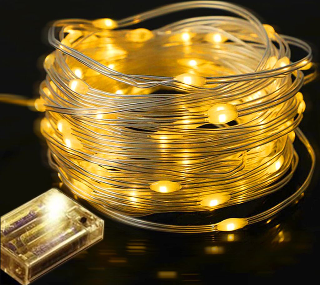 A coiled string of warm white LED lights with a clear battery pack.