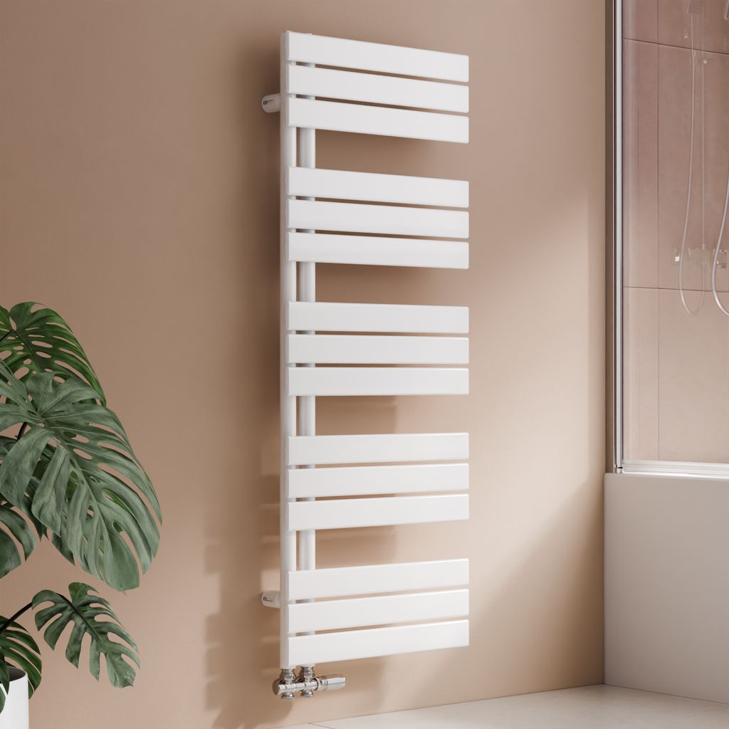 A white designer radiator is shown in a bathroom setting next to a large plant.