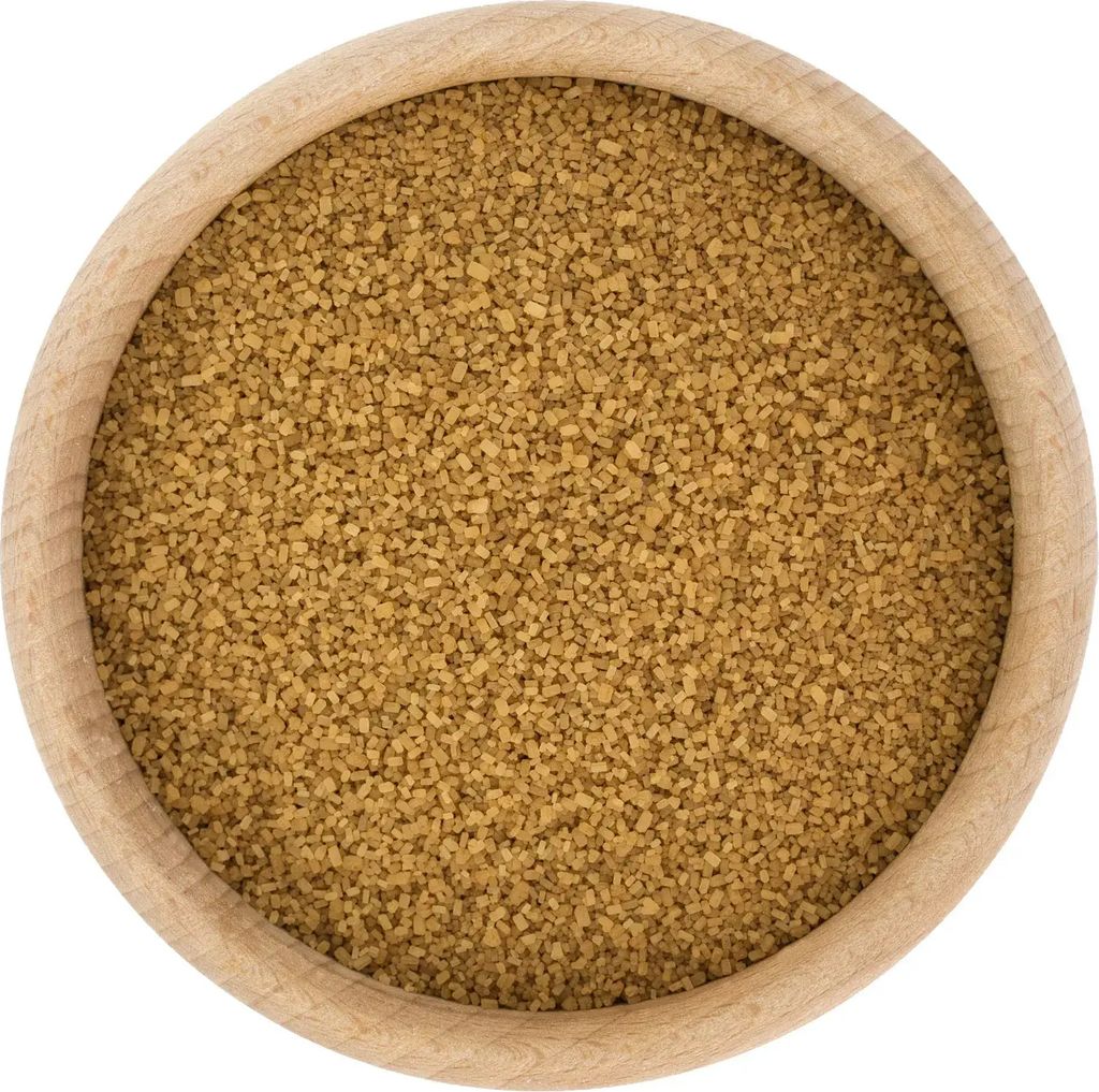 A close-up, top-down view of brown sugar in a wooden bowl.