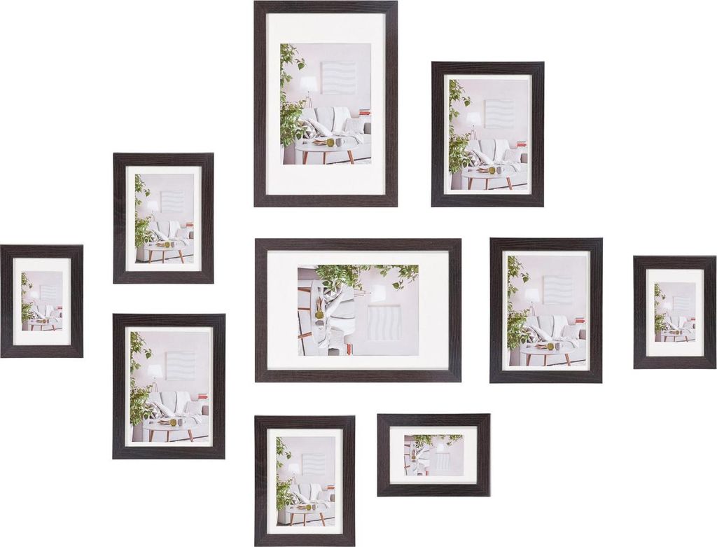A collection of empty picture frames arranged in a gallery wall style on a white background.