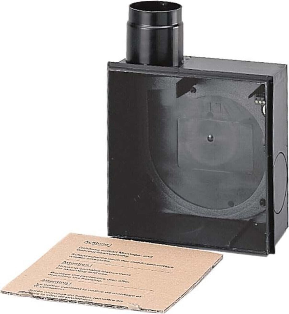 A black plastic housing unit with a circular pipe attachment on top, and an instruction manual lying in front of it on a white background.