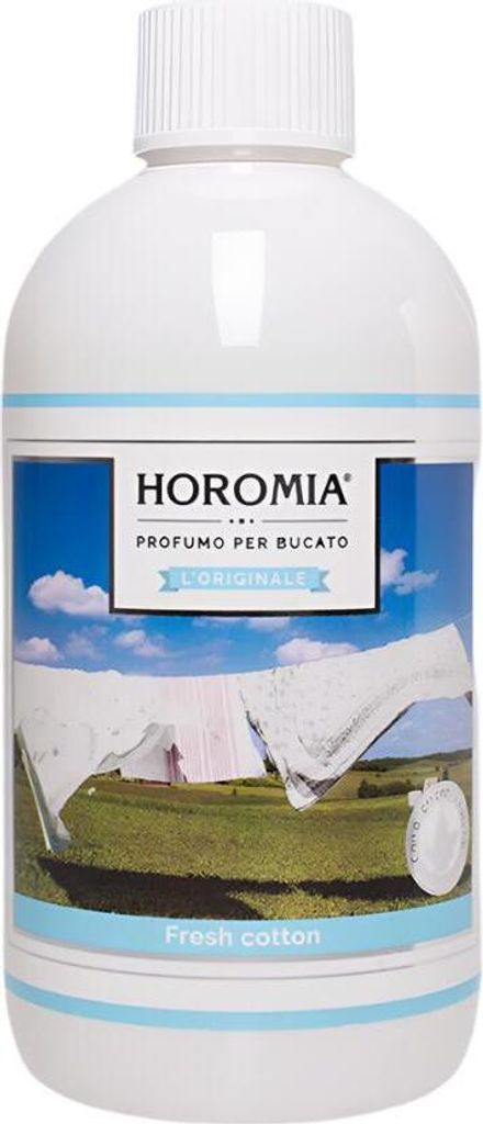 A bottle of fabric softener with a label showing laundry drying on a clothesline.