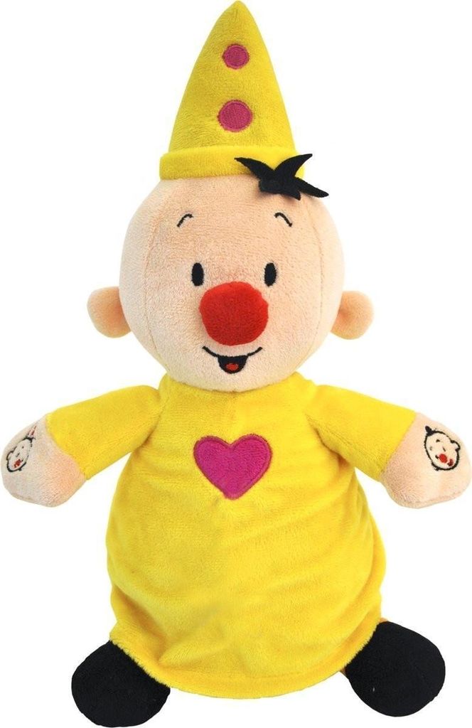 A stuffed toy clown with a yellow outfit and a pink heart.