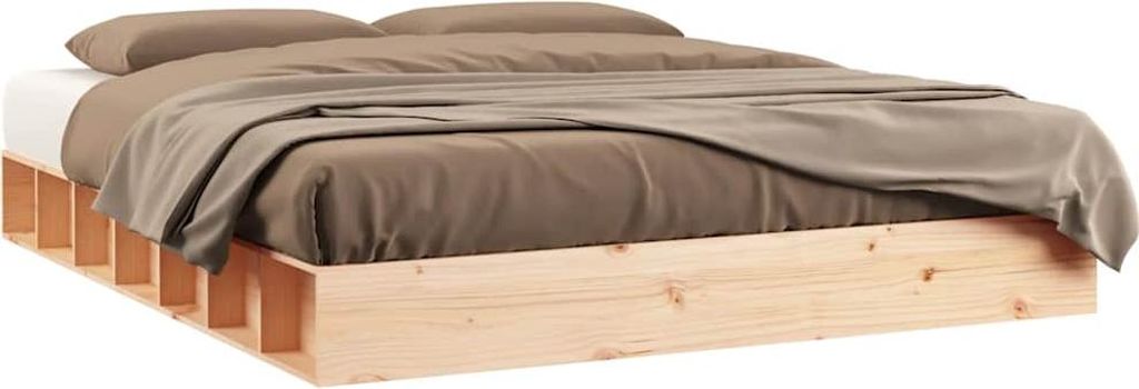 A bed frame with bedding.