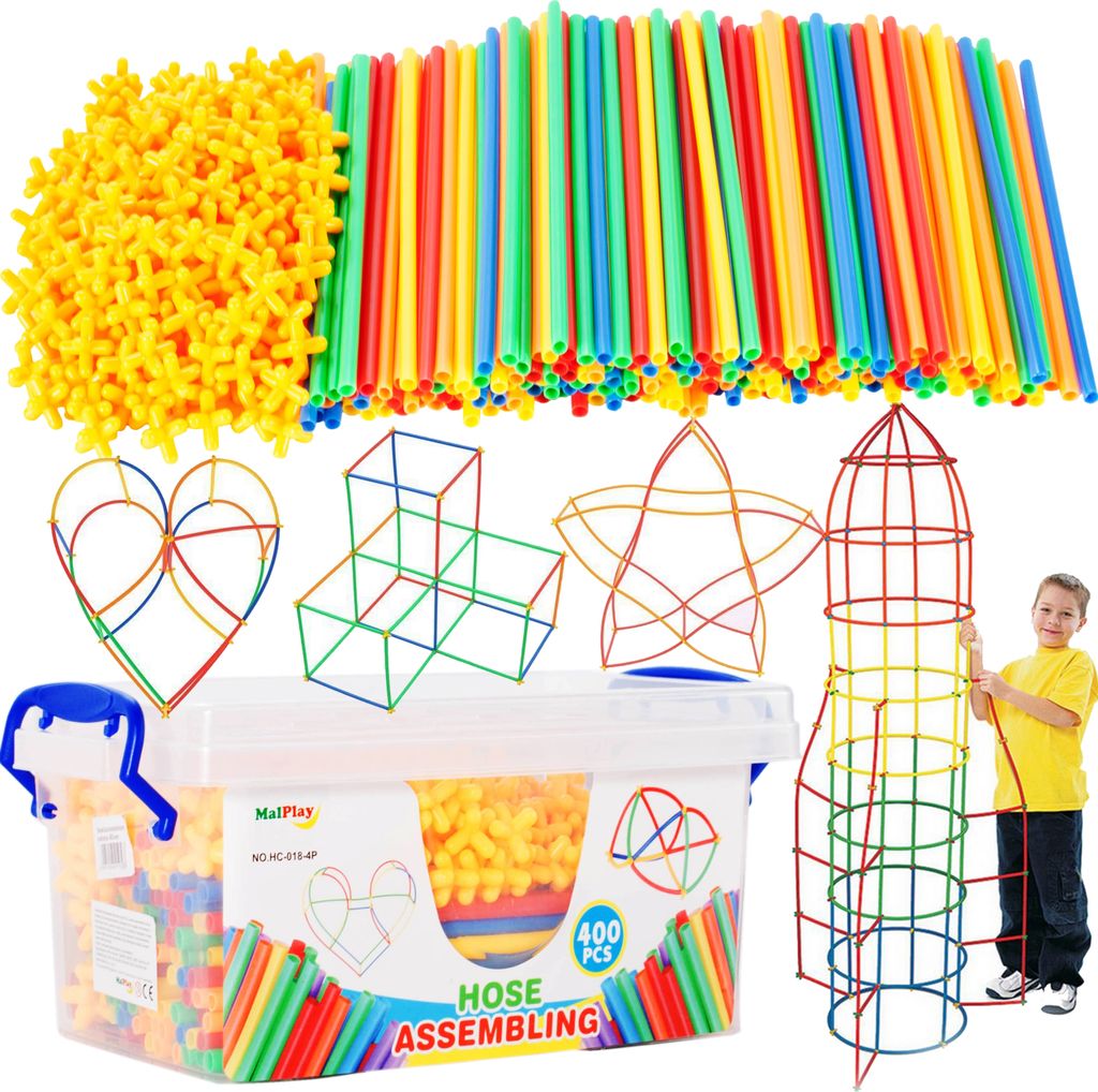 A collection of colorful building sticks and connectors, along with a child playing with a rocket-shaped structure made from them.
