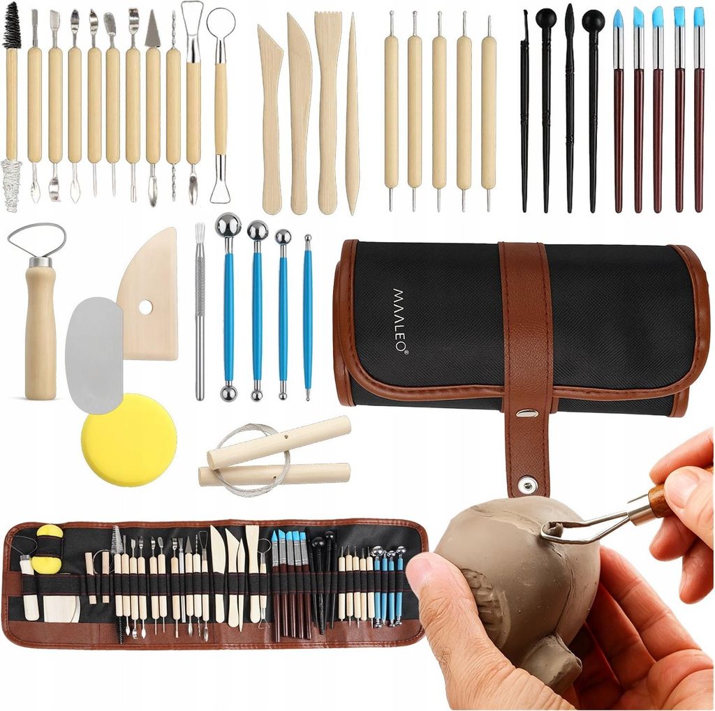 A collection of pottery sculpting tools laid out and a hand using a tool on clay.