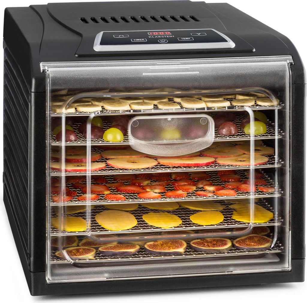A black food dehydrator with multiple trays filled with various dried fruits, presented on a white background.