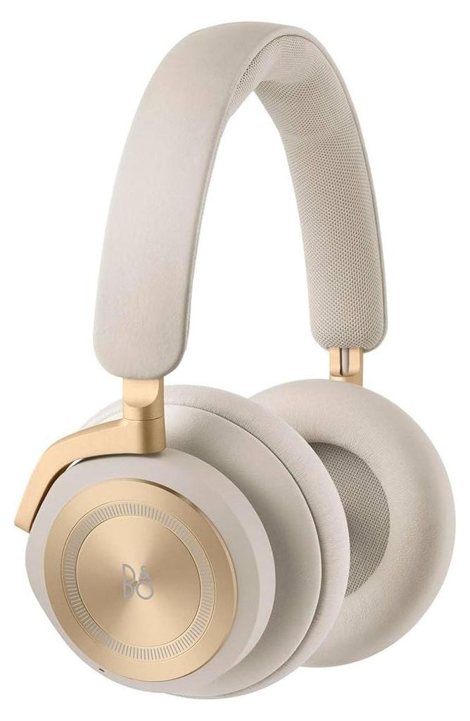 A pair of cream and gold over-ear headphones.