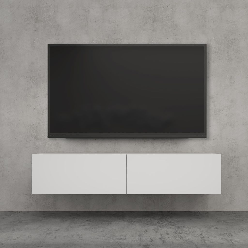 A modern TV mounted on a concrete wall above a floating white cabinet.