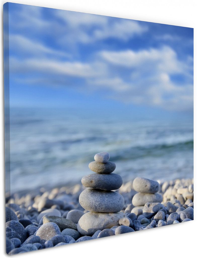 Wallario Premium Leinwandbild Steinstapel am Strand in Größe 50 x 50 cm