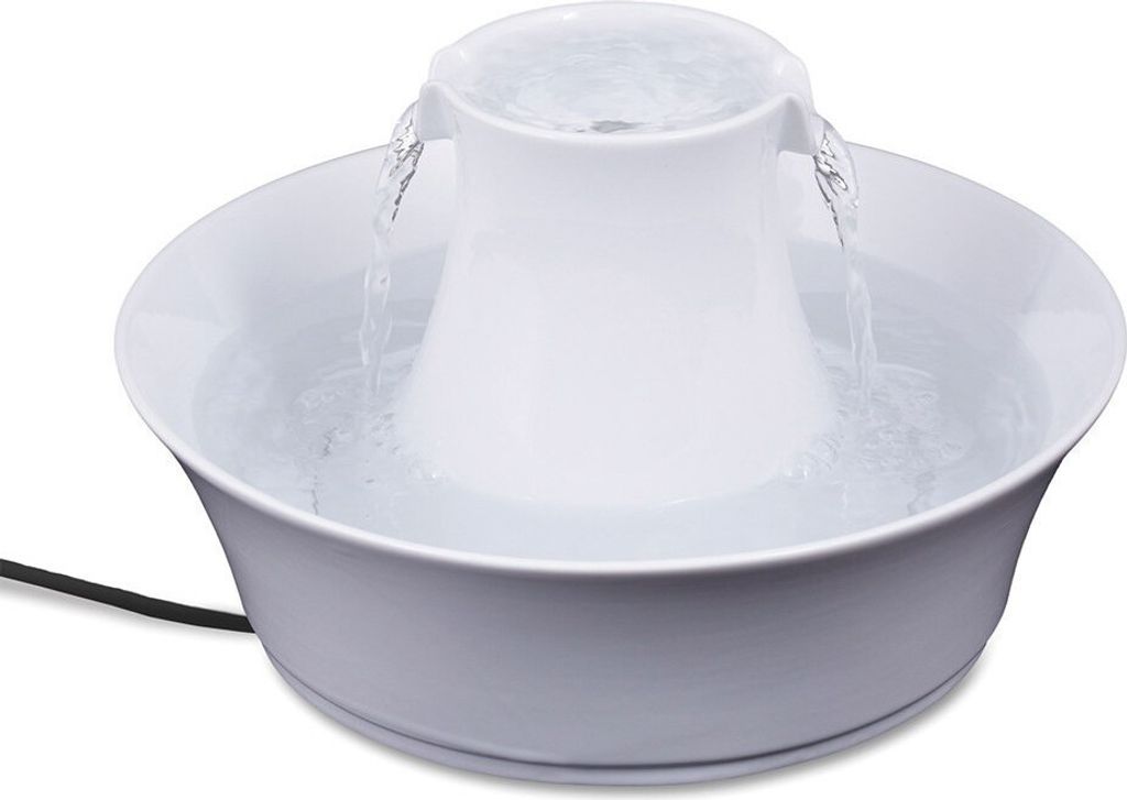 A white pet water fountain with water flowing from the top into a basin.
