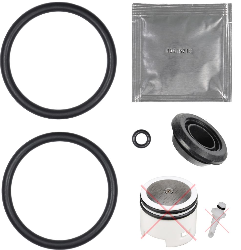 A collection of various O-rings and some small plastic parts, likely for a coffee machine repair kit.
