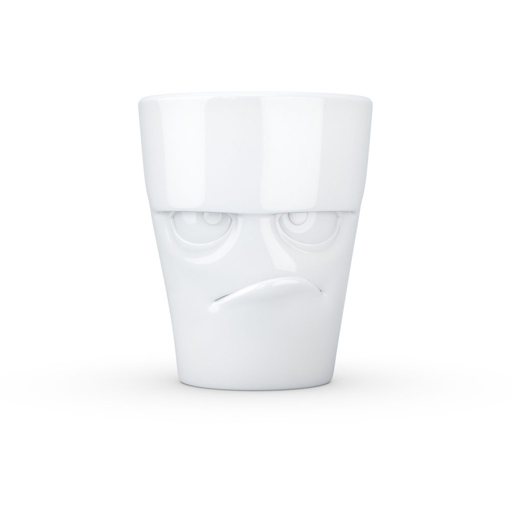 A white ceramic mug with a grumpy face design.