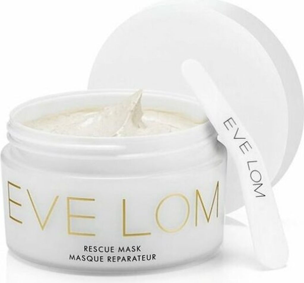 A white jar of Eve Lom Rescue Mask with a spatula resting on the lid.