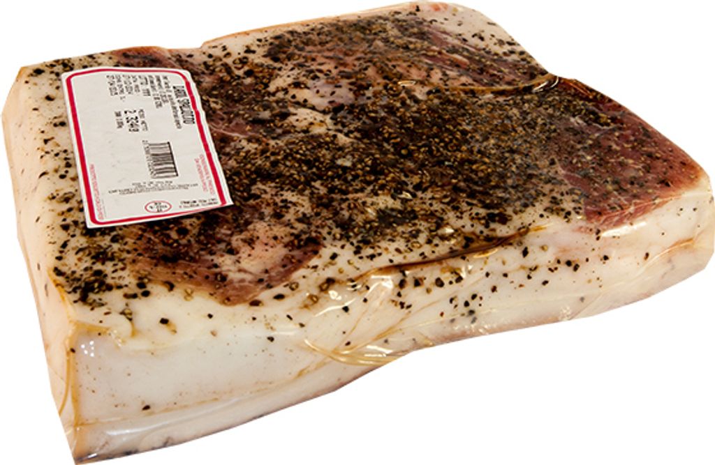 A block of cured pork fat, seasoned with spices, wrapped in plastic, with a price tag attached.