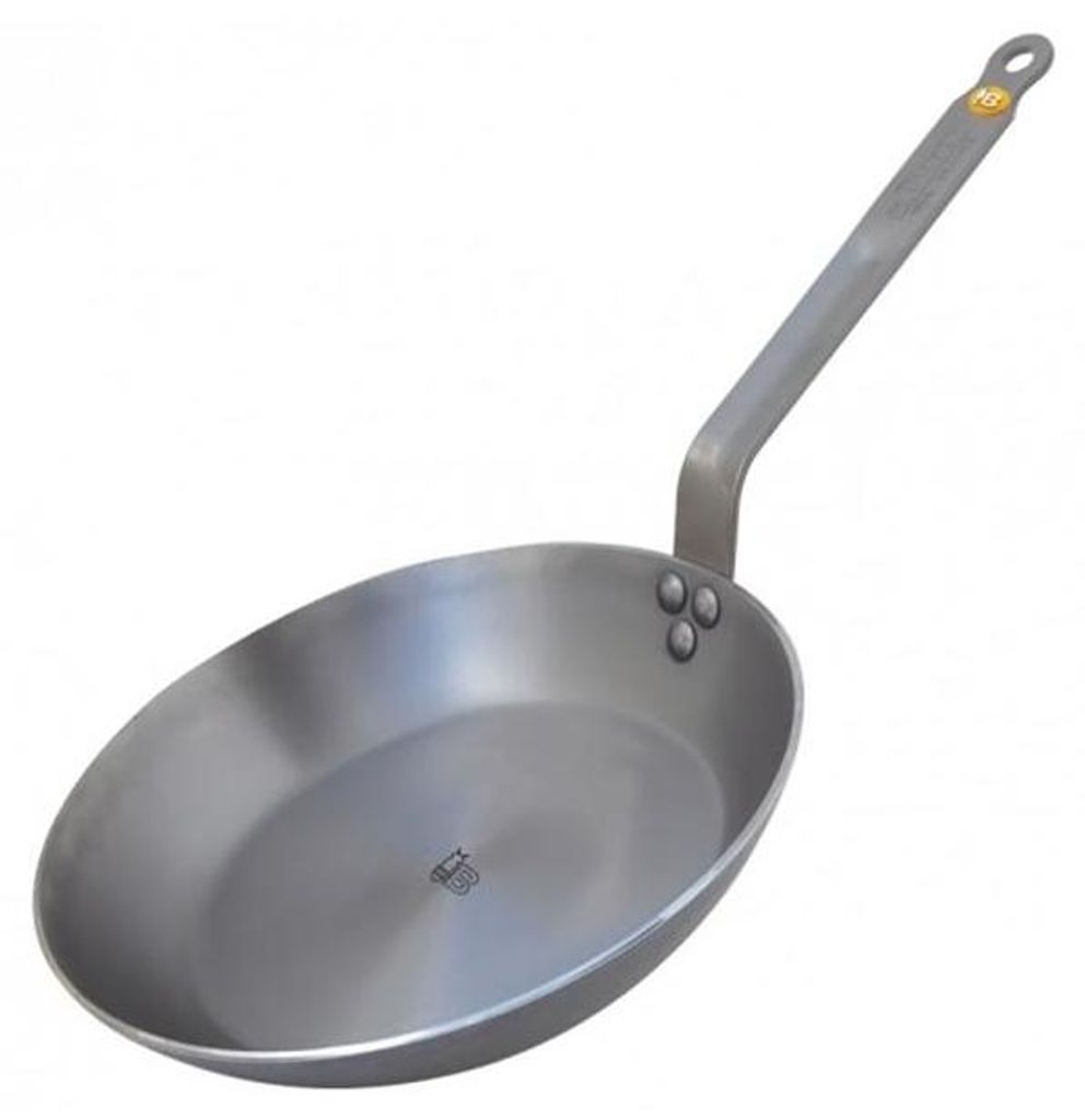 A single de buyer mineral b frying pan on a white background.