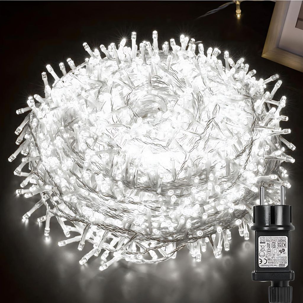 A coiled string of white LED lights with a black power adapter.