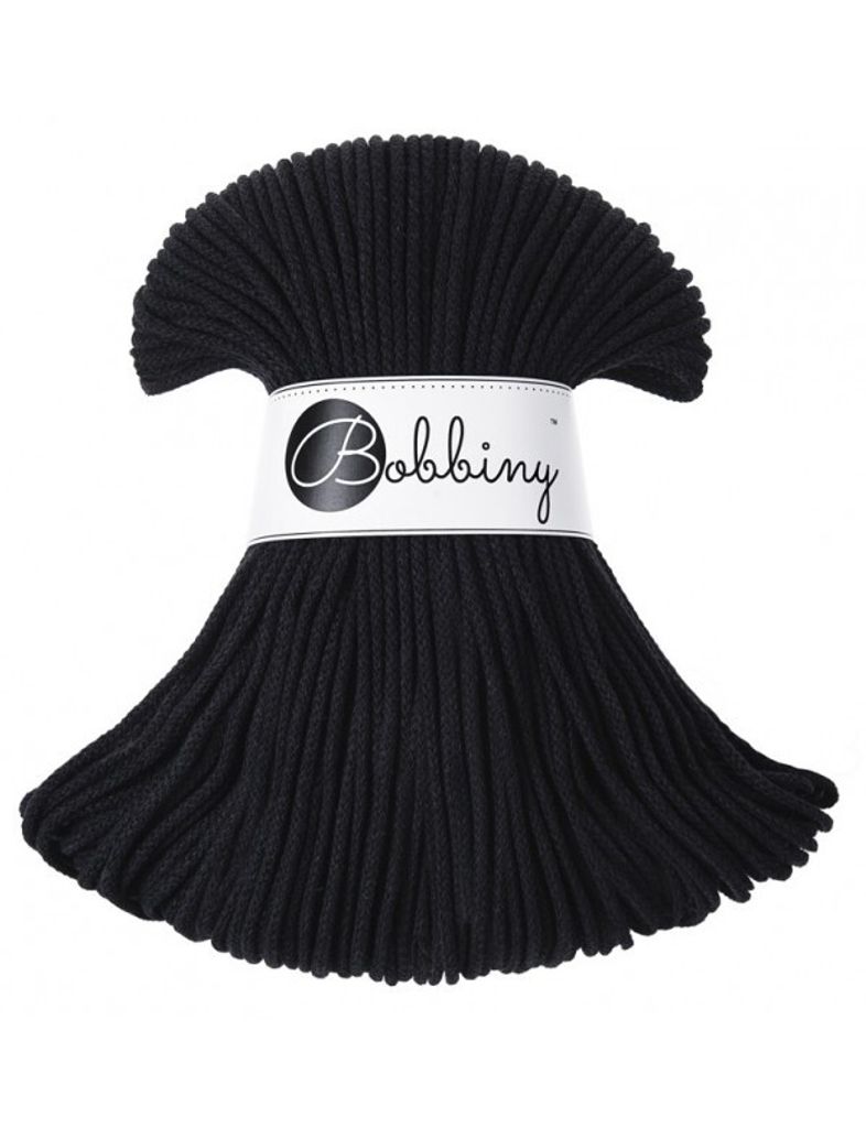 A bundle of black cord is displayed against a white background, with a label around the middle.