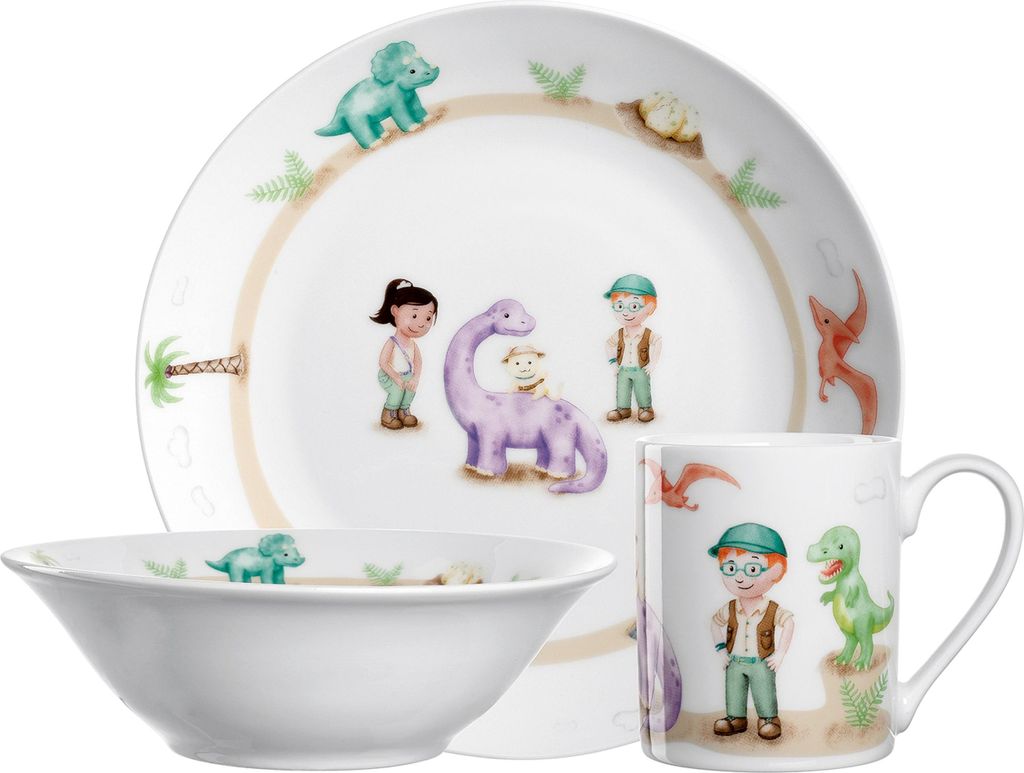 A set of children's dinnerware with dinosaur and child illustrations.