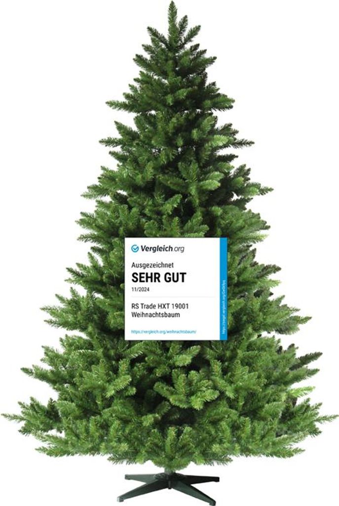 A green artificial Christmas tree with a blue and white award badge attached to it.