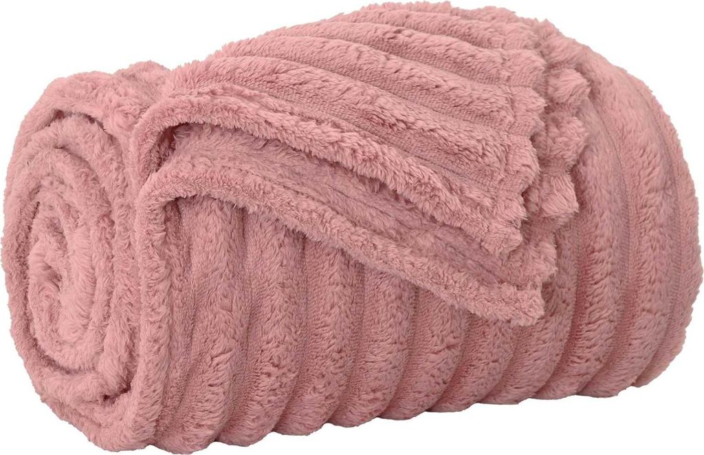 A rolled-up pink fleece blanket with a ribbed texture.