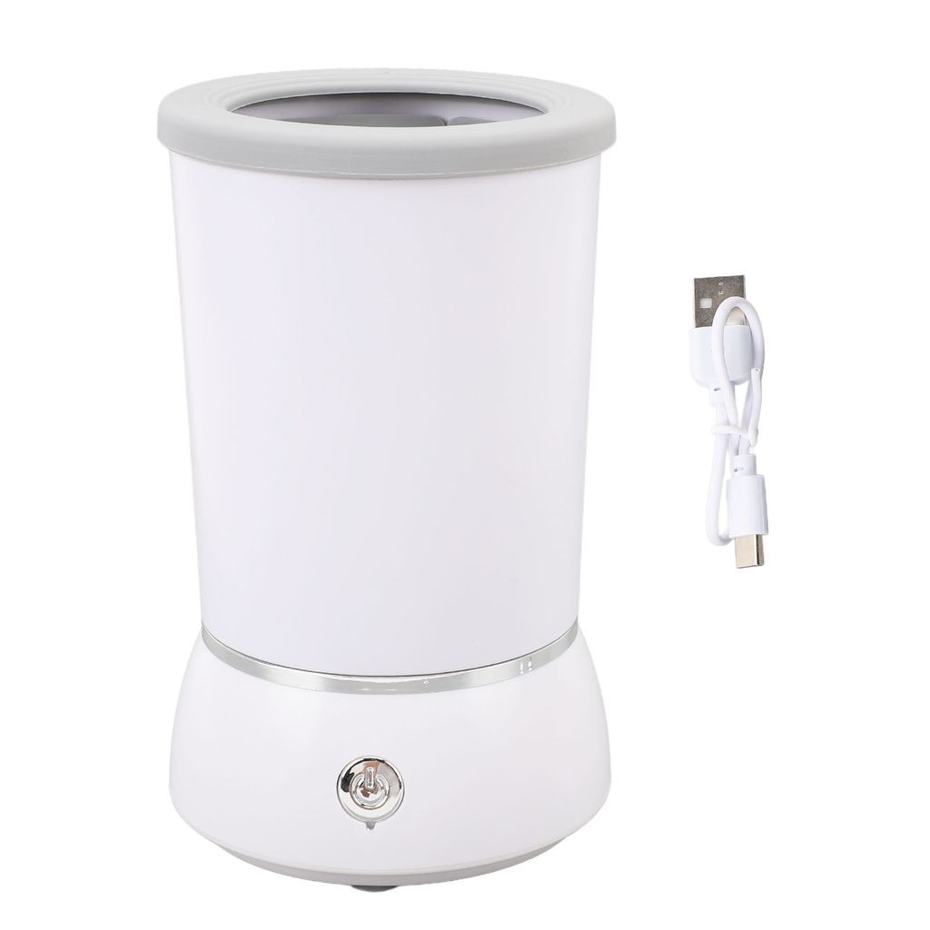 A white automatic dog paw cleaner with a gray rim and a USB charging cable on a white background.