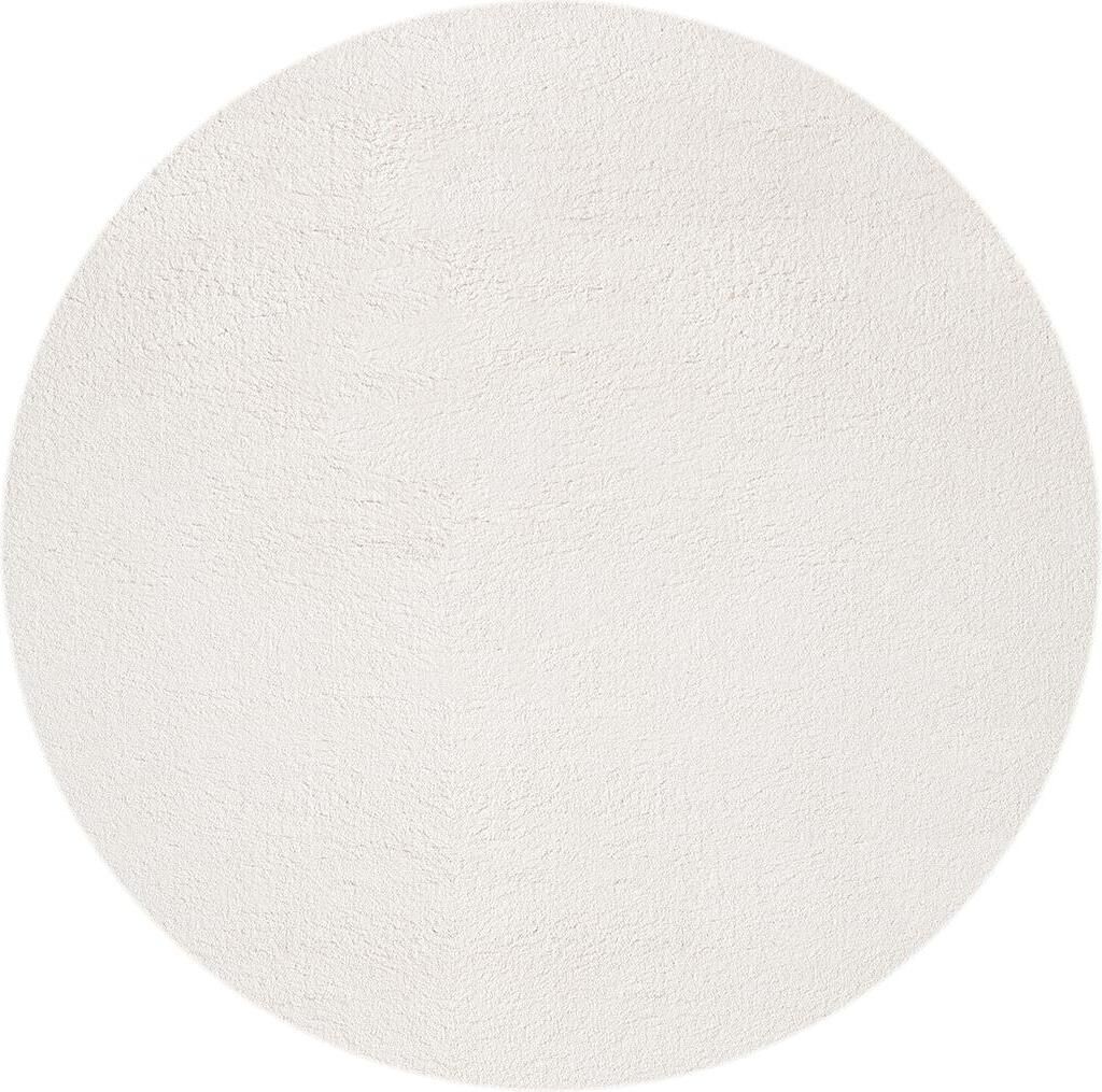 A plain white round rug.