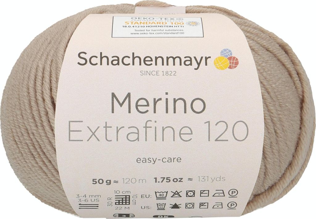 A ball of beige yarn with a label wrapped around it.
