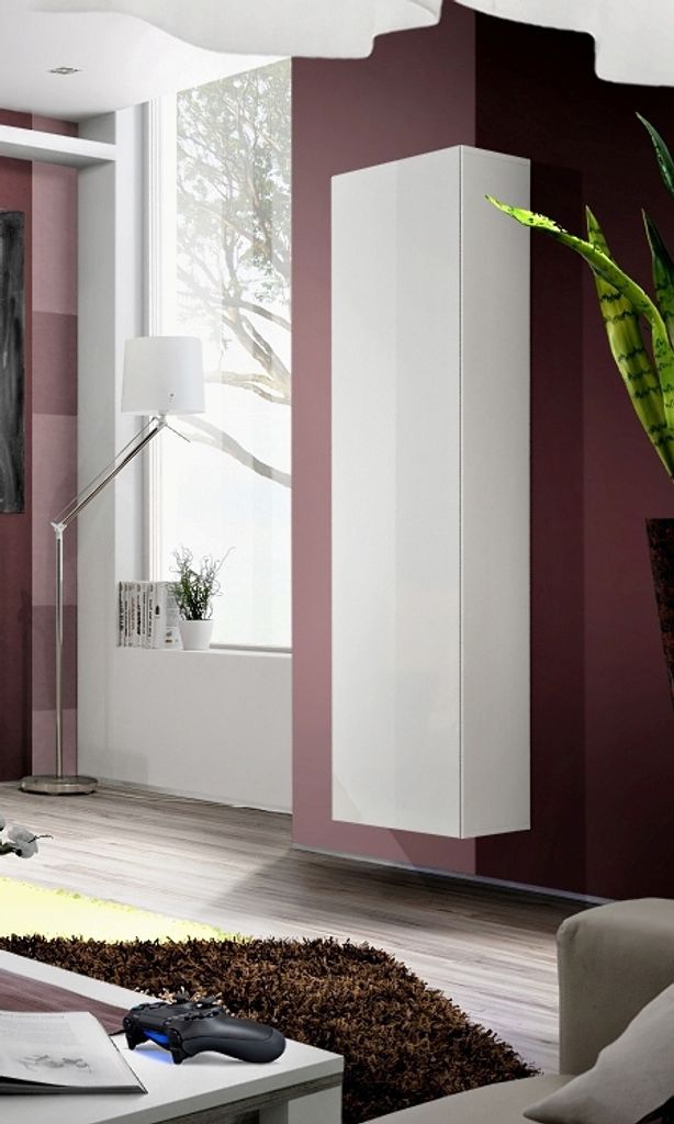 A modern living room with a white cabinet mounted on a maroon wall.