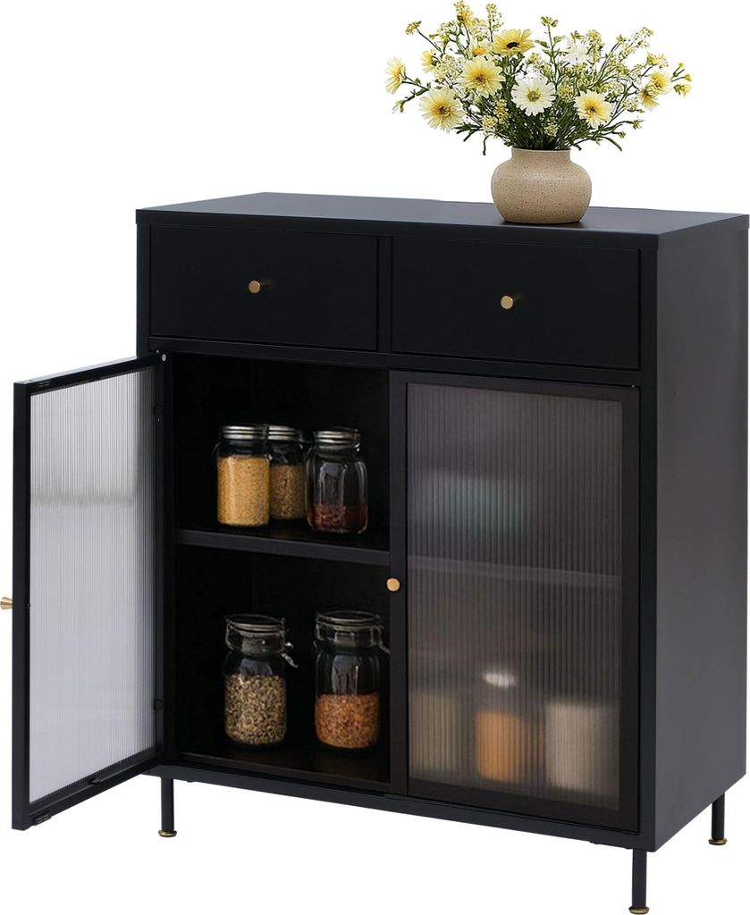 A black sideboard with two drawers and two cabinet doors, one of which is open, revealing jars of food items. A vase of yellow flowers sits on top.