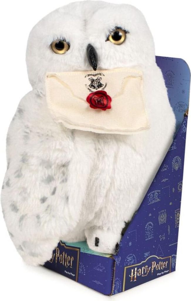 A plush toy owl holding an envelope, presented in its retail packaging.