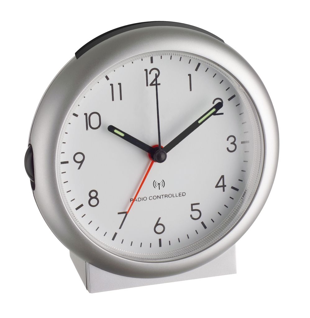A silver analog alarm clock with a white face.