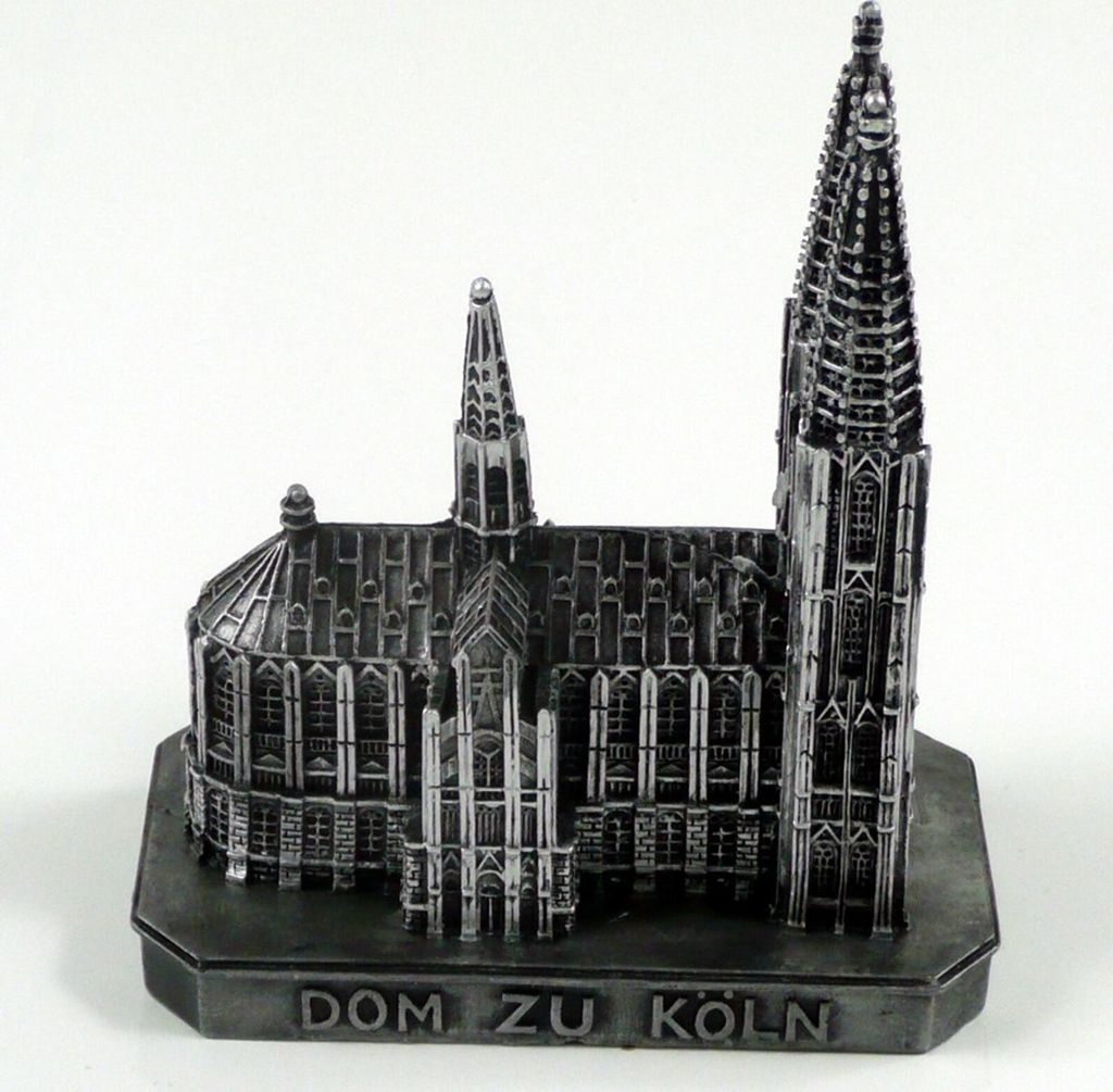A miniature model of the Cologne Cathedral (Kölner Dom) on a display base.