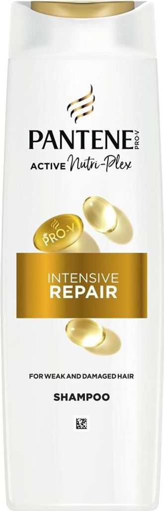 A white bottle of Pantene shampoo with gold accents and text.