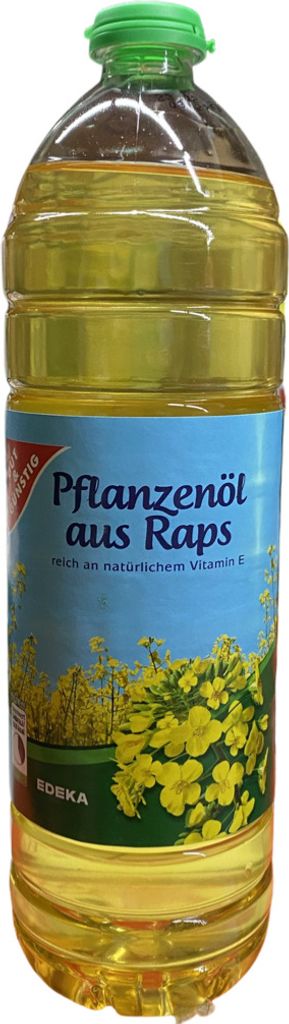 A bottle of cooking oil with a label showing rapeseed flowers.