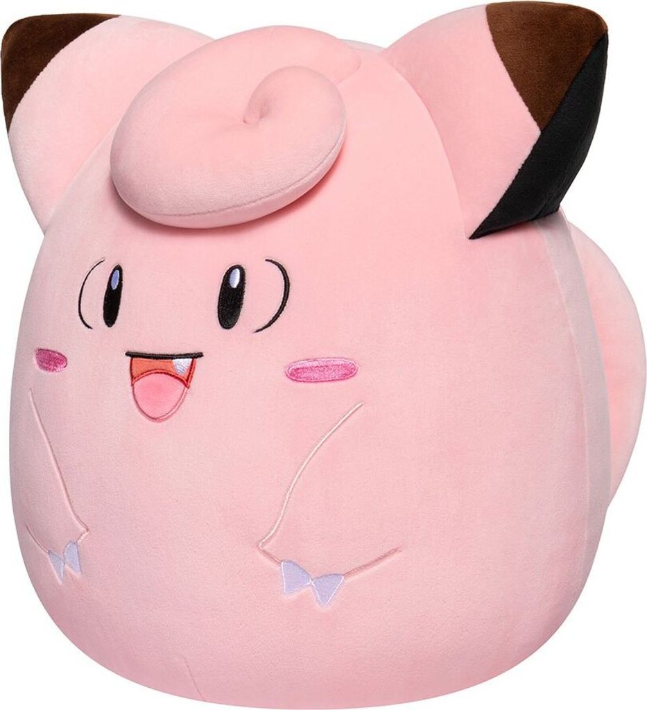 A close-up, front-facing studio shot of a pink Clefairy plush toy.