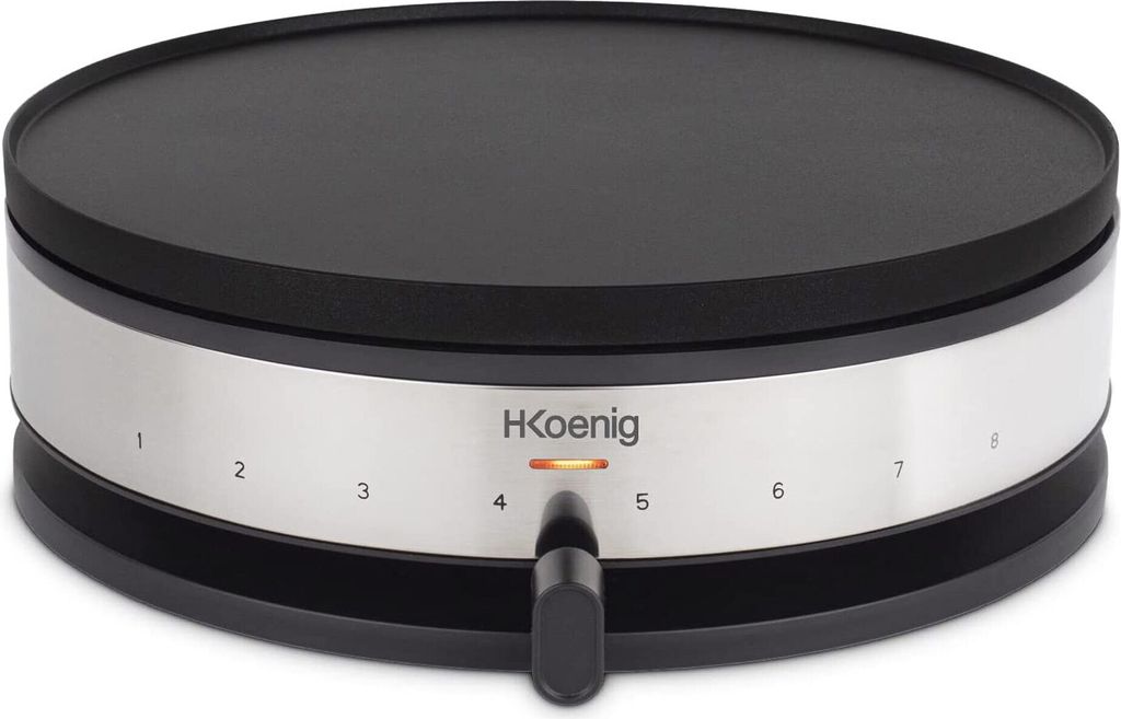 A close-up studio shot of a black and silver electric crepe maker.