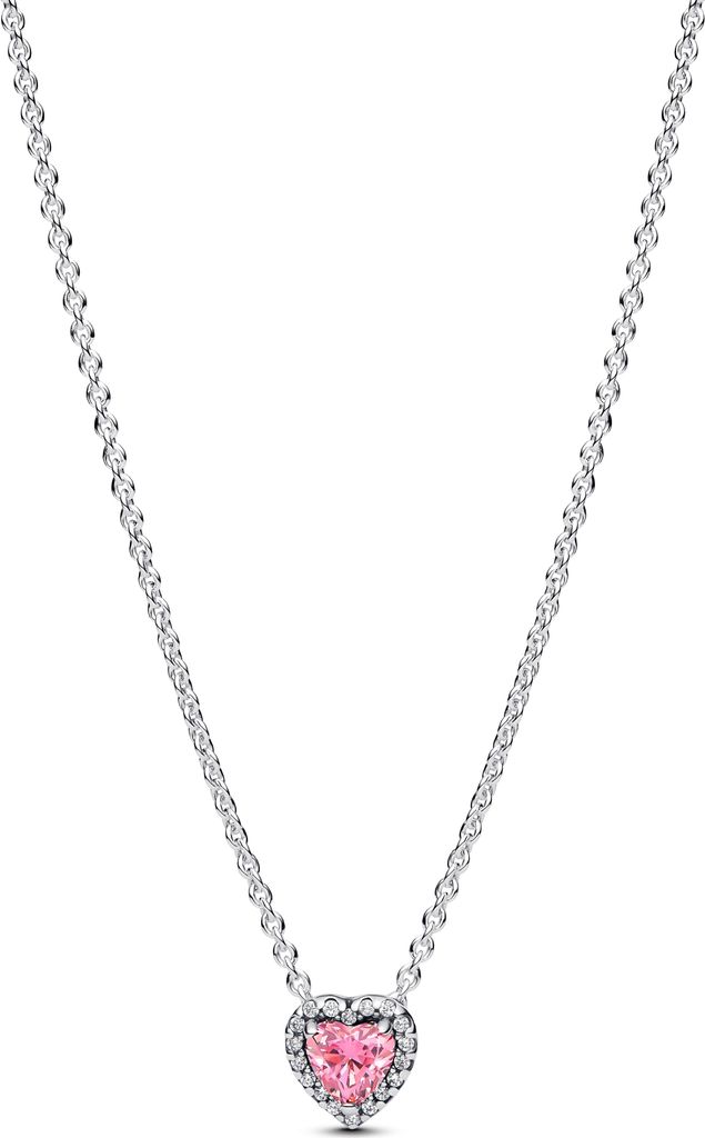 A close-up studio shot of a silver necklace with a pink heart-shaped pendant.