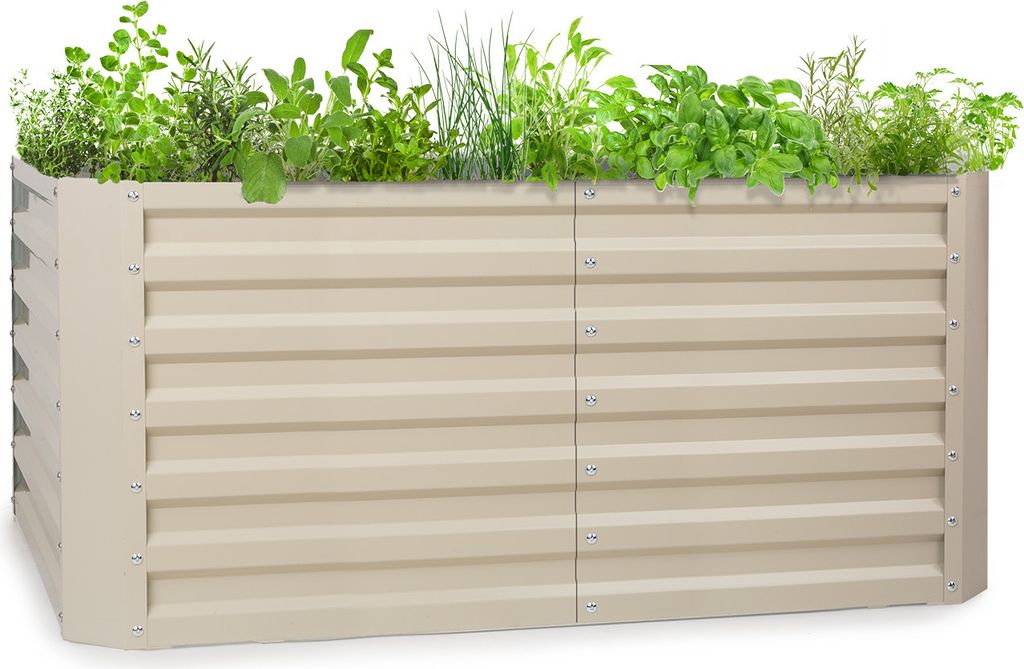 A raised garden bed filled with various herbs and plants.