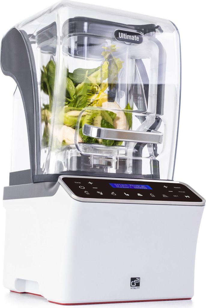 A white G21 blender with a clear pitcher filled with green vegetables.