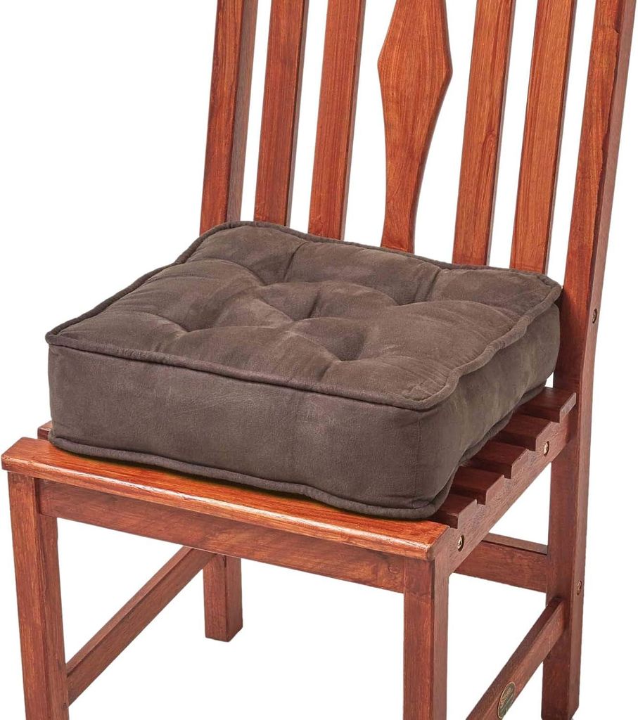A brown seat cushion on a wooden chair.