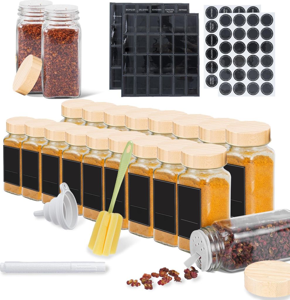 A collection of spice jars and accessories arranged on a white background.