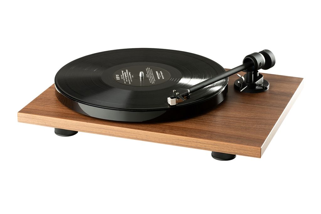 A turntable with a record on it, shown from a slightly elevated side angle against a white background.