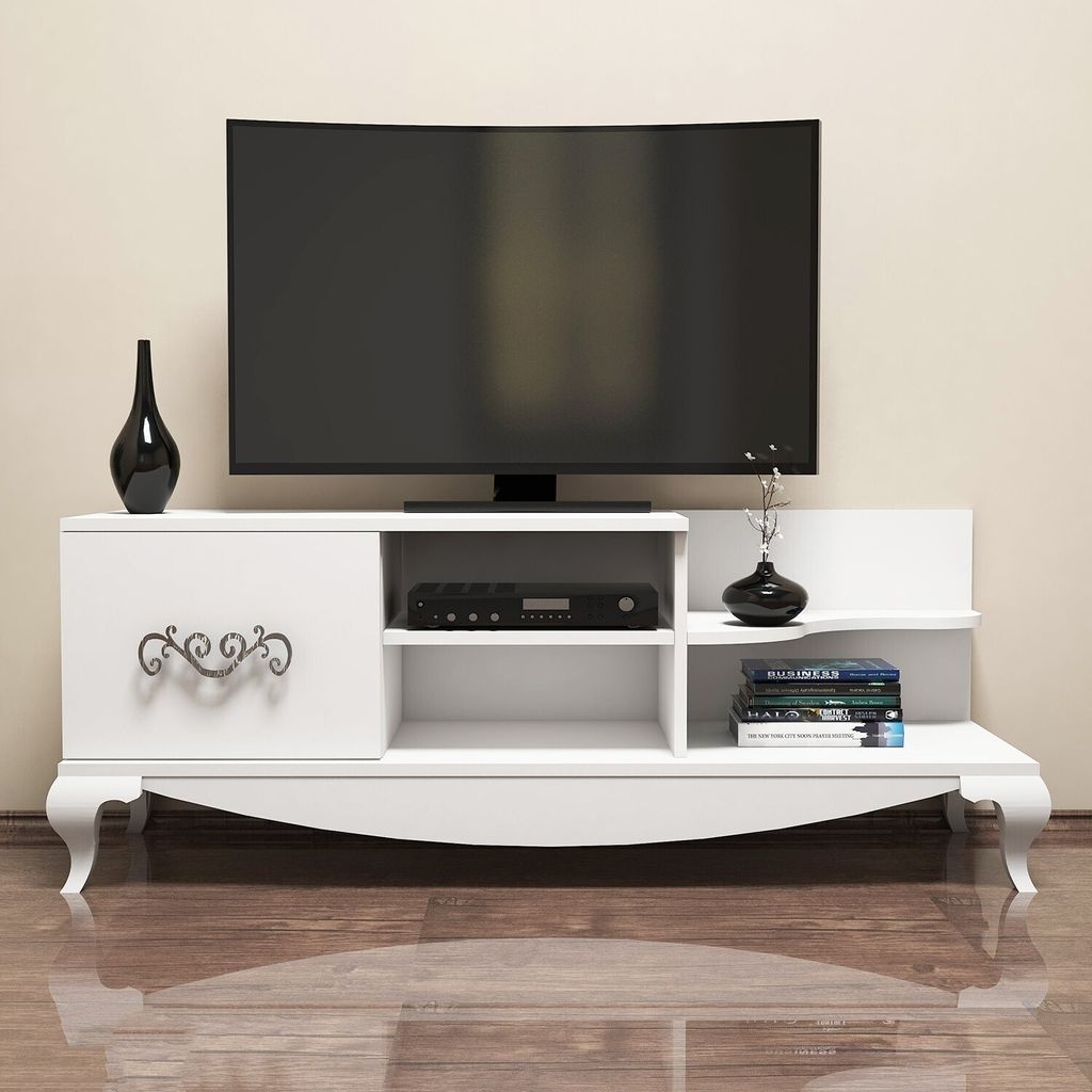 A white TV stand with a TV on top, and decorative items on the shelves.